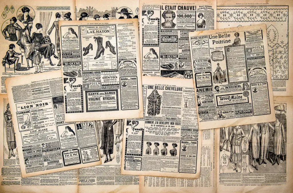 Newspaper pages with antique advertising.