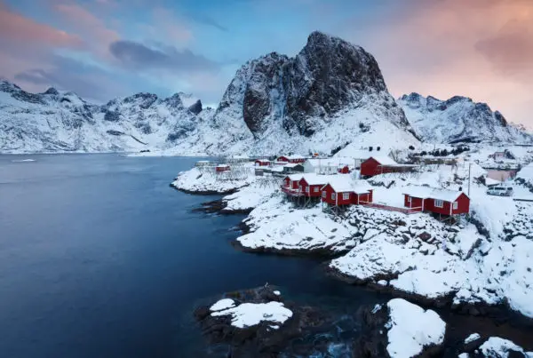 Frozen houses in the mountain field